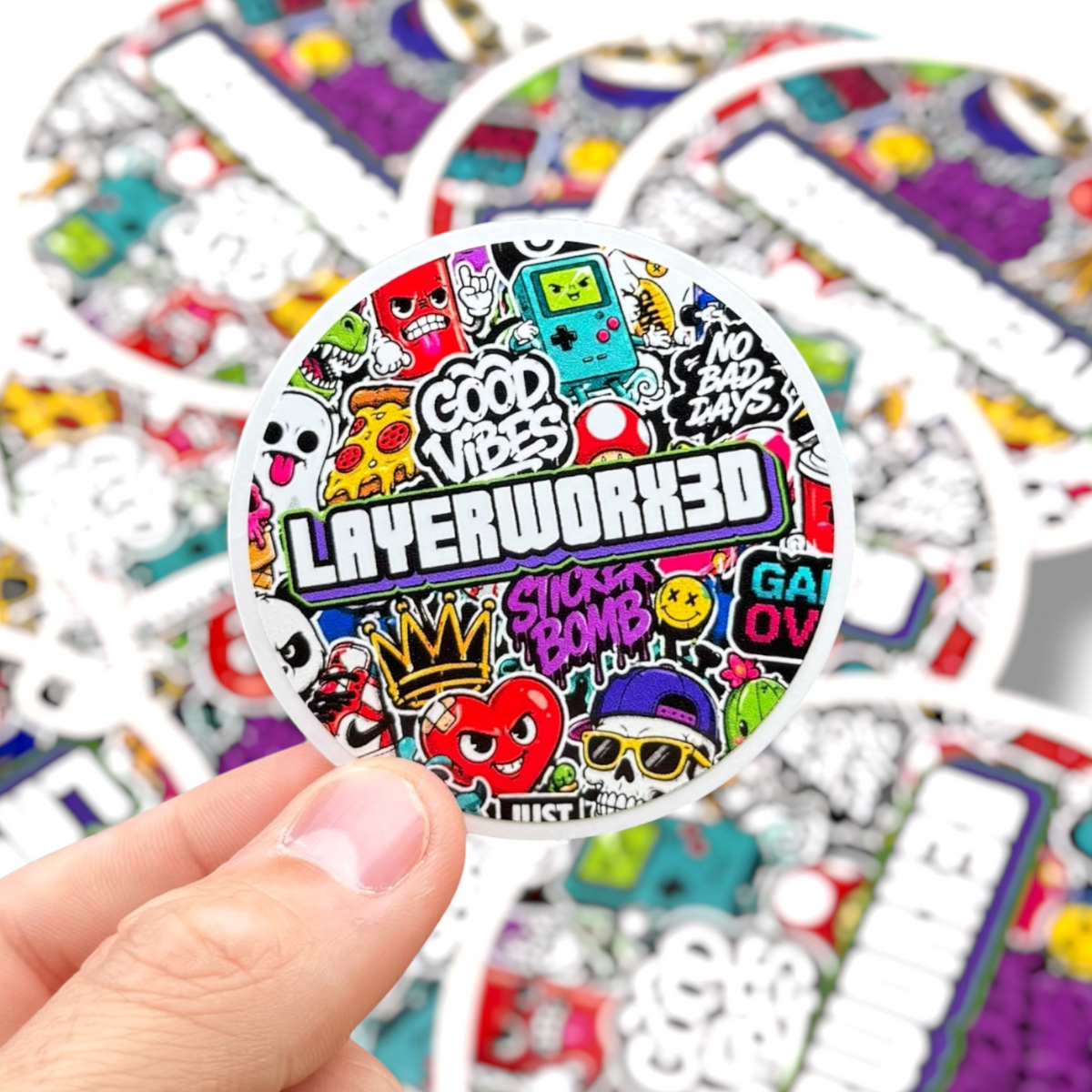 Layerworx3d gloss custom die-cut vinyl stickers displayed in various shapes and sizes on a white background.